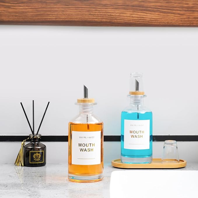 11.8OZ Glass Mouthwash Dispenser for Bathroom with Stainless Steel & Bamboo Nozzle, Mouthwash Cup Reusable, Bamboo Tray, and Elegant Gold Sticker.Set of 2（Clear